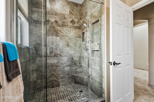 full bathroom with tile patterned floors and a stall shower