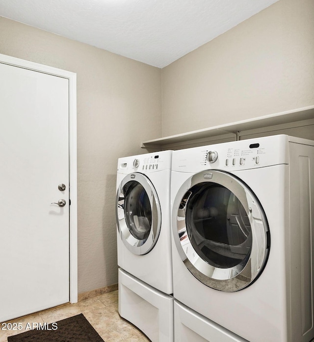 laundry area with laundry area and independent washer and dryer