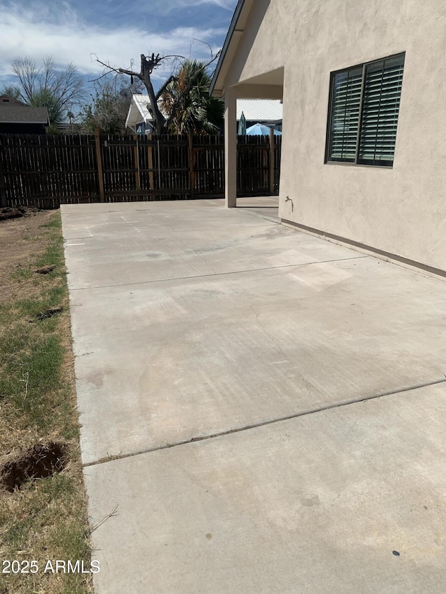 view of patio with fence