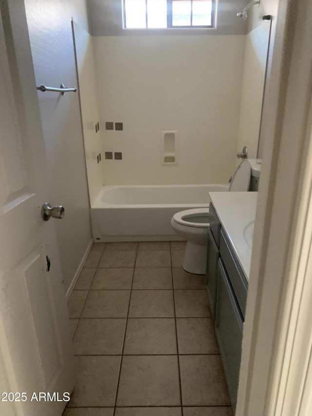 full bath with vanity, toilet, tile patterned flooring, and shower / tub combination