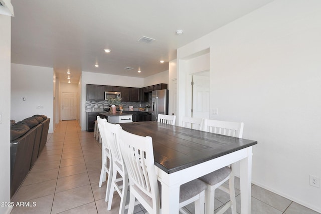 dining room featuring light tile patterned flooring