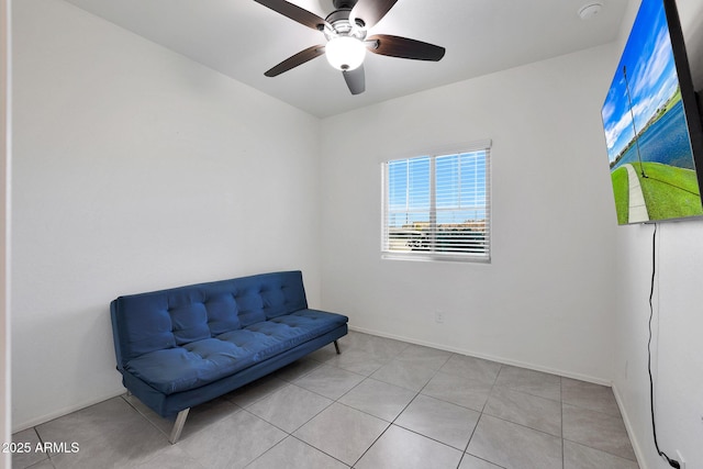 sitting room featuring ceiling fan and light tile patterned flooring