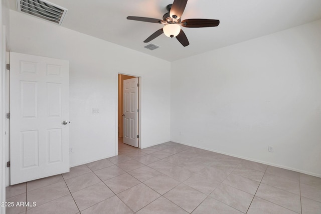 unfurnished room featuring ceiling fan and light tile patterned floors