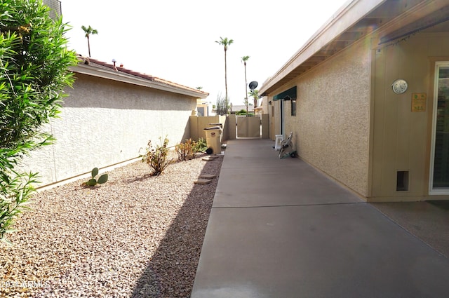 view of side of home featuring a patio area