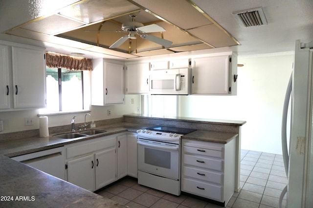 kitchen featuring white cabinetry, white appliances, and sink