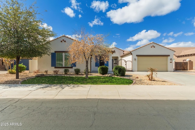 mediterranean / spanish-style home featuring an attached garage, fence, a tile roof, driveway, and stucco siding