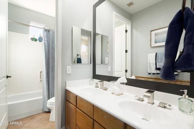 full bathroom featuring double vanity, visible vents, toilet, and a sink