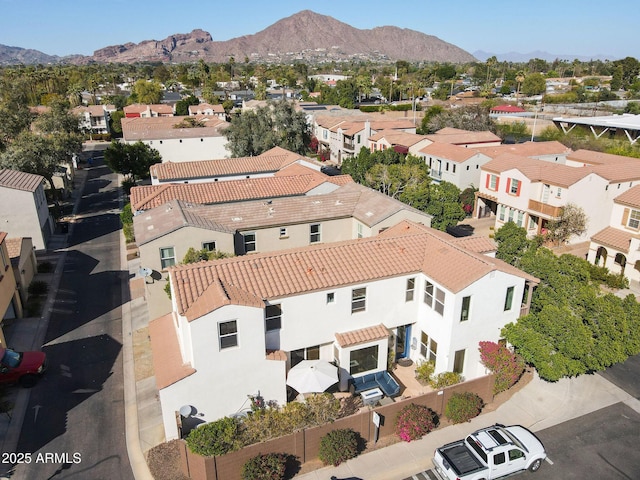 drone / aerial view featuring a mountain view and a residential view