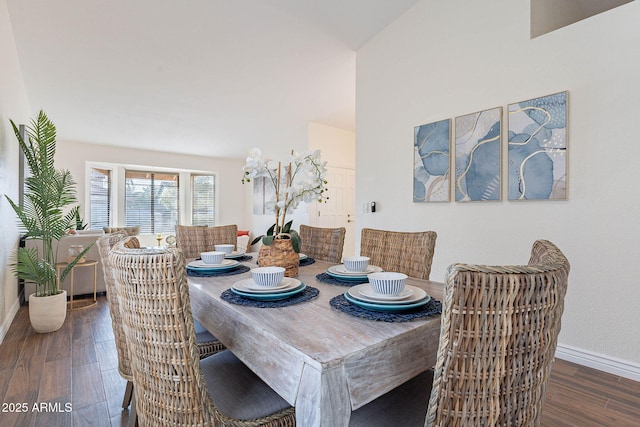 dining space with dark hardwood / wood-style flooring