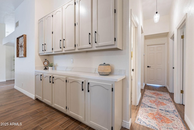 interior space with dark hardwood / wood-style floors