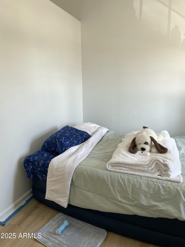 3324 W Mcrae Way Unit 2, Phoenix, AZ 85027 - bedroom featuring wood finished floors and baseboards