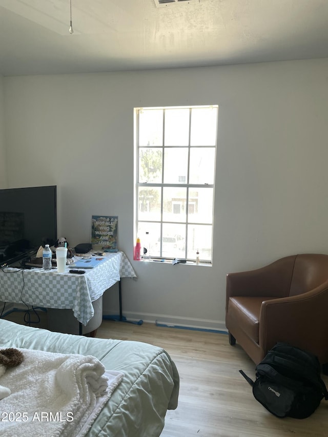 3324 W Mcrae Way Unit 2, Phoenix, AZ 85027 - bedroom featuring wood finished floors and baseboards