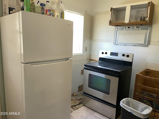 3324 W Mcrae Way Unit 2, Phoenix, AZ 85027 - kitchen with freestanding refrigerator, electric stove, open shelves, and light tile patterned floors