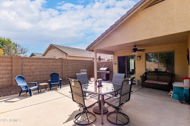 view of patio / terrace with a ceiling fan, outdoor dining space, fence, and grilling area