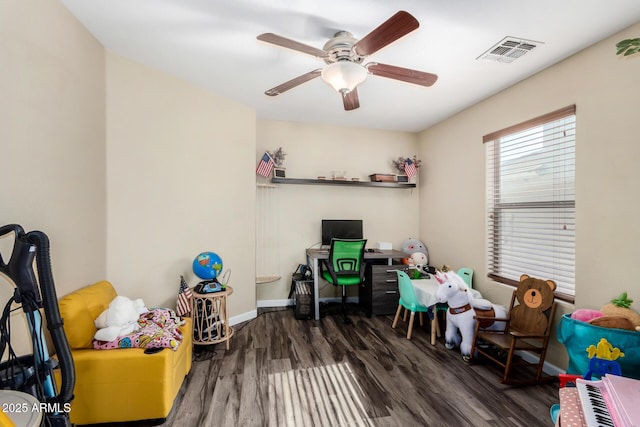 recreation room featuring a ceiling fan, baseboards, visible vents, and wood finished floors