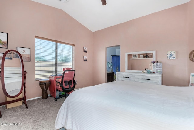 bedroom featuring light carpet, baseboards, connected bathroom, a ceiling fan, and lofted ceiling