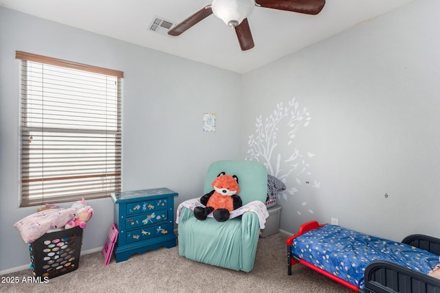 carpeted bedroom featuring baseboards, visible vents, and a ceiling fan