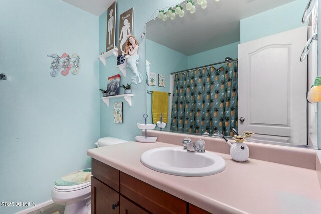 bathroom featuring vanity, toilet, and a shower with curtain