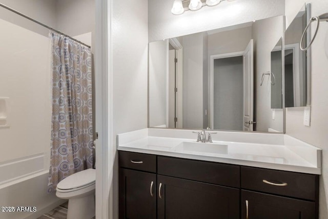 full bathroom featuring vanity, toilet, and shower / bath combo with shower curtain