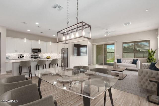 dining room with ceiling fan