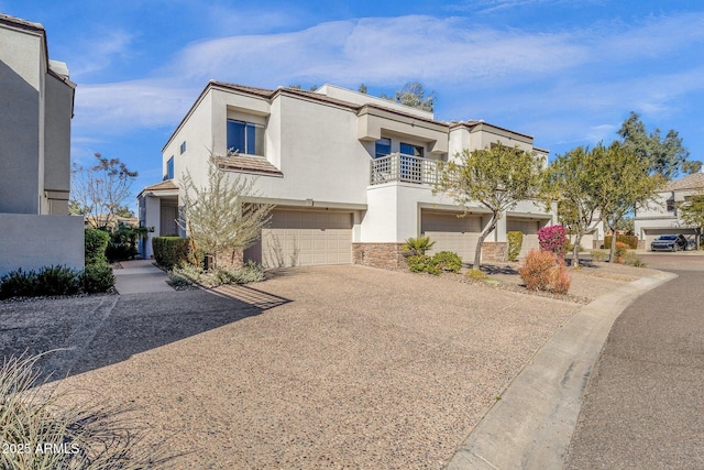 view of front of property with a balcony and a garage