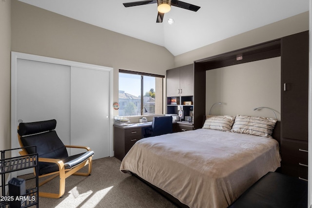 carpeted bedroom featuring ceiling fan, a closet, and lofted ceiling