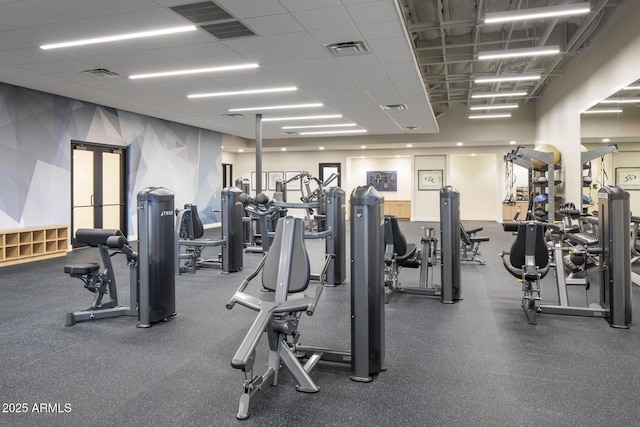 workout area featuring a drop ceiling