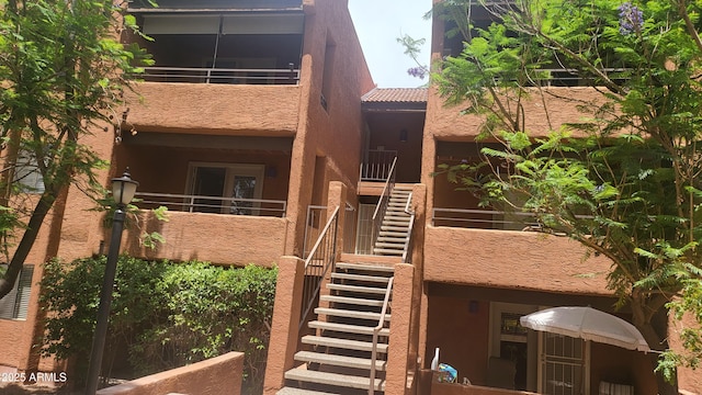 4704 E Paradise Village Pkwy N Unit 211, Phoenix, AZ 85032 - view of building exterior featuring stairway