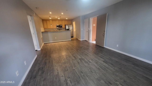 4704 E Paradise Village Pkwy N Unit 211, Phoenix, AZ 85032 - unfurnished living room featuring baseboards, dark wood-style floors, and recessed lighting