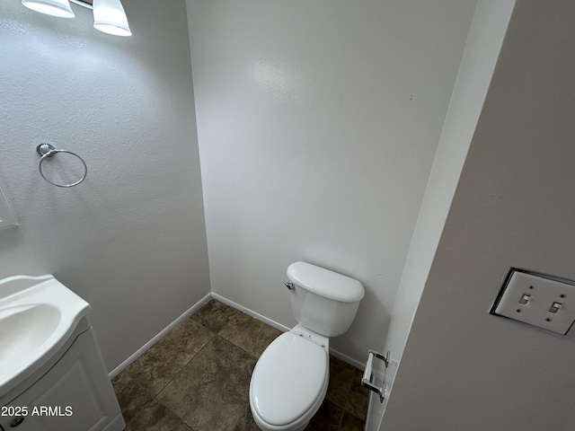 6842 S 42nd Pl, Phoenix, AZ 85042 - bathroom featuring toilet, vanity, and baseboards