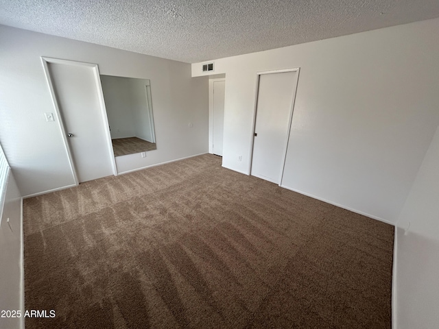6842 S 42nd Pl, Phoenix, AZ 85042 - unfurnished bedroom featuring carpet, a textured ceiling, and a closet