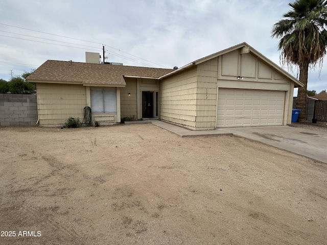 6842 S 42nd Pl, Phoenix, AZ 85042 - view of front of home featuring an attached garage, driveway, and a shingled roof