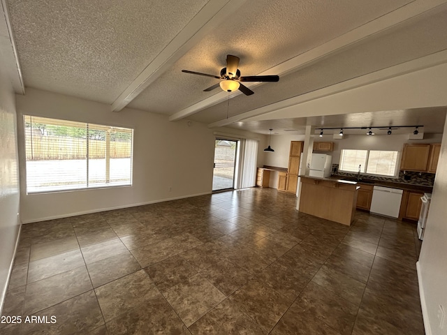 6842 S 42nd Pl, Phoenix, AZ 85042 - unfurnished living room with rail lighting, a textured ceiling, a sink, a ceiling fan, and baseboards