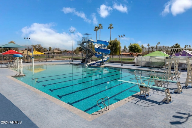 view of swimming pool featuring a water slide