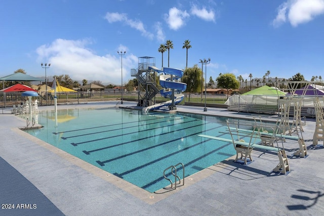 view of swimming pool featuring a water slide