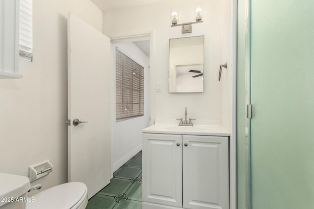 5635 N 35th Dr, Phoenix, AZ 85019 - full bathroom with toilet, vanity, and tile patterned flooring
