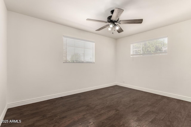5635 N 35th Dr, Phoenix, AZ 85019 - spare room with dark wood-type flooring, baseboards, and a ceiling fan