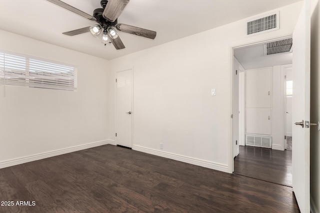 5635 N 35th Dr, Phoenix, AZ 85019 - unfurnished room featuring dark wood-type flooring, a ceiling fan, and baseboards
