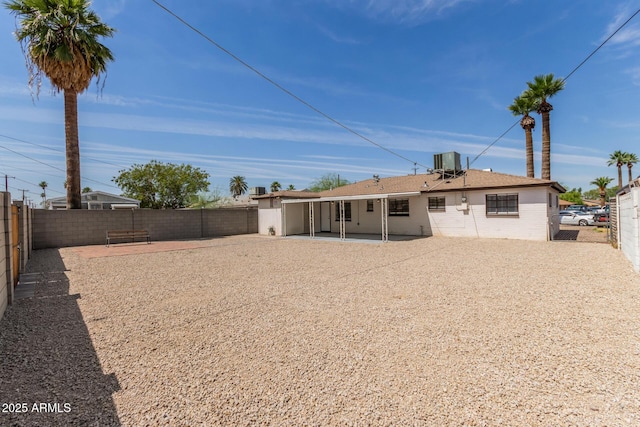 5635 N 35th Dr, Phoenix, AZ 85019 - rear view of property with cooling unit, a fenced backyard, and a patio