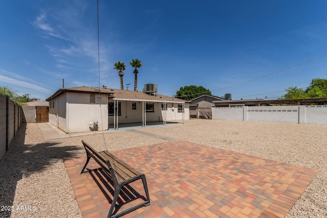 5635 N 35th Dr, Phoenix, AZ 85019 - back of property with a fenced backyard, a patio, and central AC unit