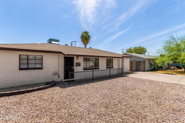 5635 N 35th Dr, Phoenix, AZ 85019 - ranch-style home featuring brick siding, driveway, a shingled roof, and a garage