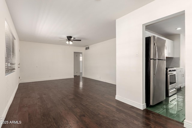 5635 N 35th Dr, Phoenix, AZ 85019 - unfurnished room featuring ceiling fan, dark wood-type flooring, and baseboards
