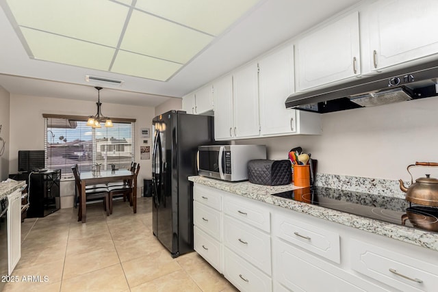 kitchen featuring decorative light fixtures, white cabinets, light tile patterned flooring, black appliances, and a chandelier