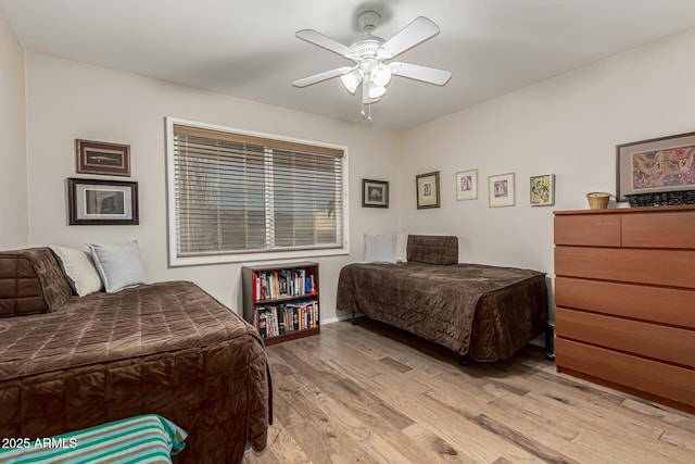 bedroom featuring light wood-type flooring and ceiling fan