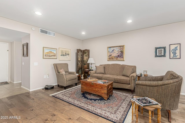 living room with light hardwood / wood-style flooring