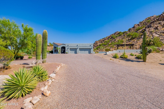 ranch-style house featuring a garage