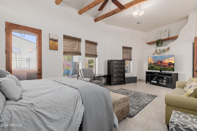 tiled bedroom featuring a towering ceiling, beamed ceiling, and ceiling fan