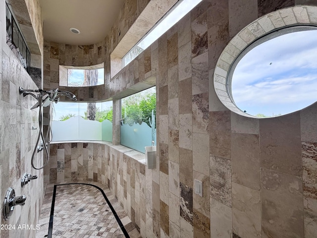 bathroom featuring tile walls