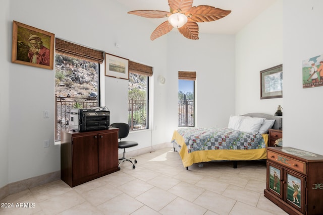 bedroom with light tile patterned flooring and ceiling fan