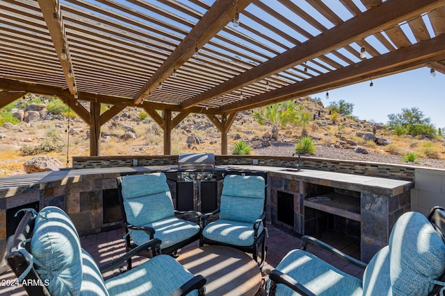 view of patio with a pergola and grilling area